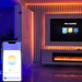 Image of smartphone app controlling CCT Adjustable LED Rope Light in Warm White CCT colours along the edges and trims of a living room wall and around the TV giving the room a gradient glow.
