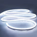 Image of NimbusFlex® CCT Adjustable LED Rope Light in an S-shape on a flat surface showing cool white illumination against a light grey backdrop.