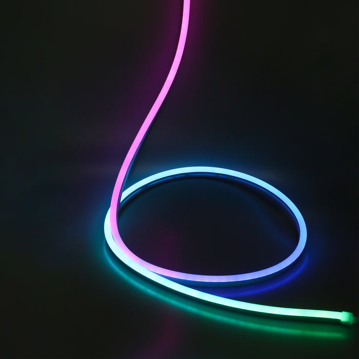 An image showing the NimbusFlex® RGBIC Neon LED Rope Light in a single loop multicoloured pattern against a dark backdrop.